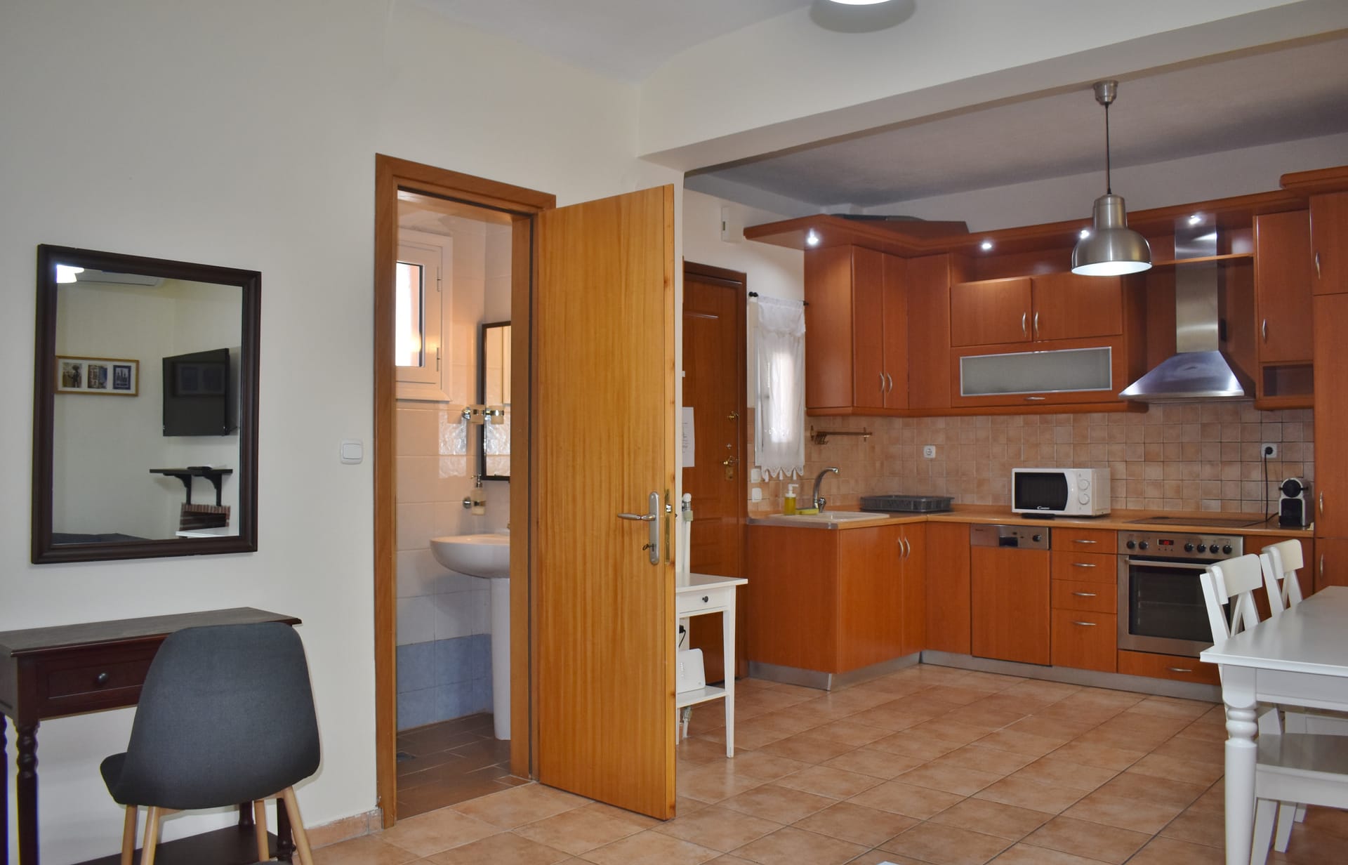 Kripis house villa PefkohoriFirst level- Sitting room with kitchen and private small garden. Also small WC in this level- A/C.