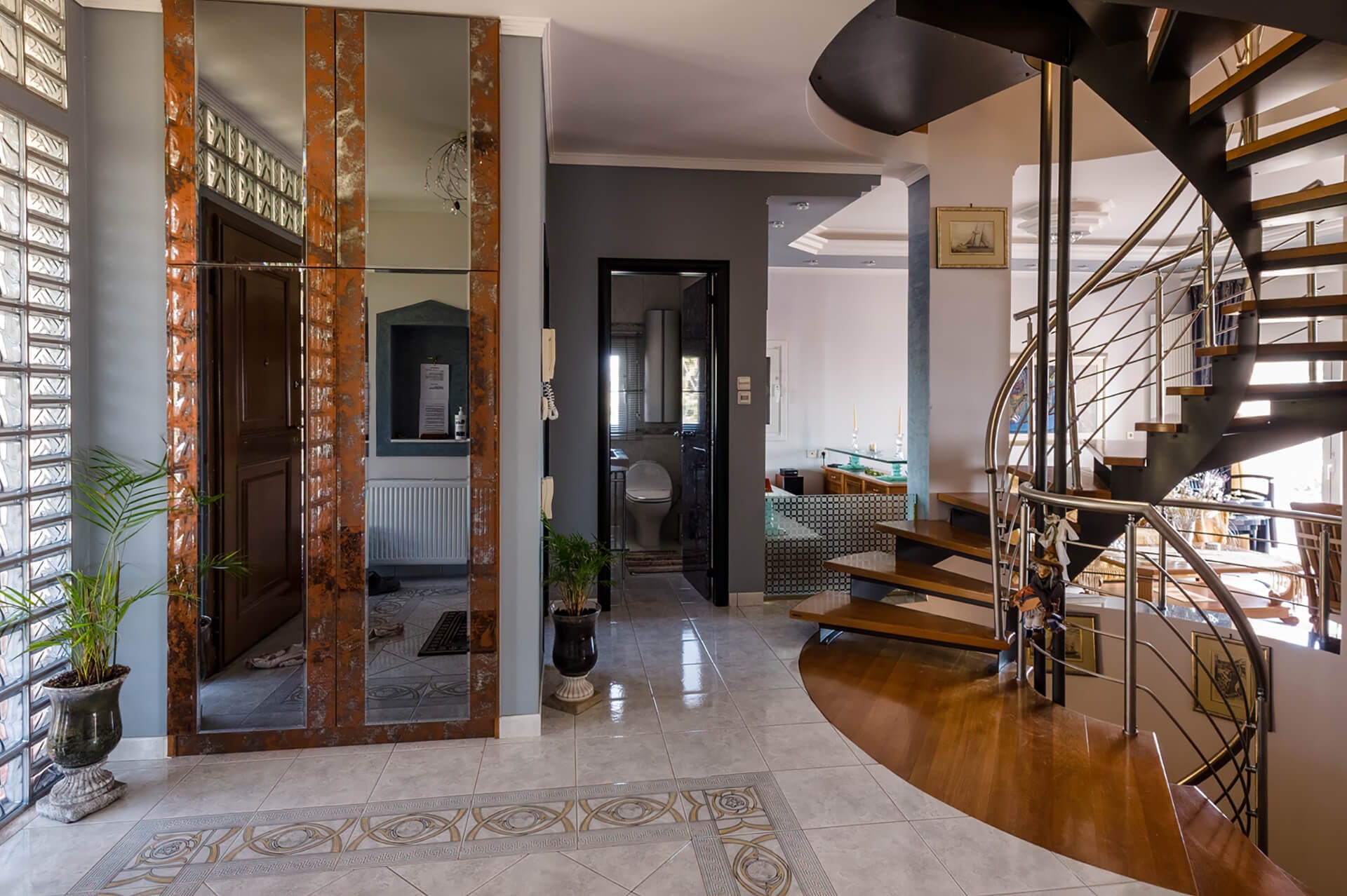 Main entrance. Luxury-elegant interior stairs.