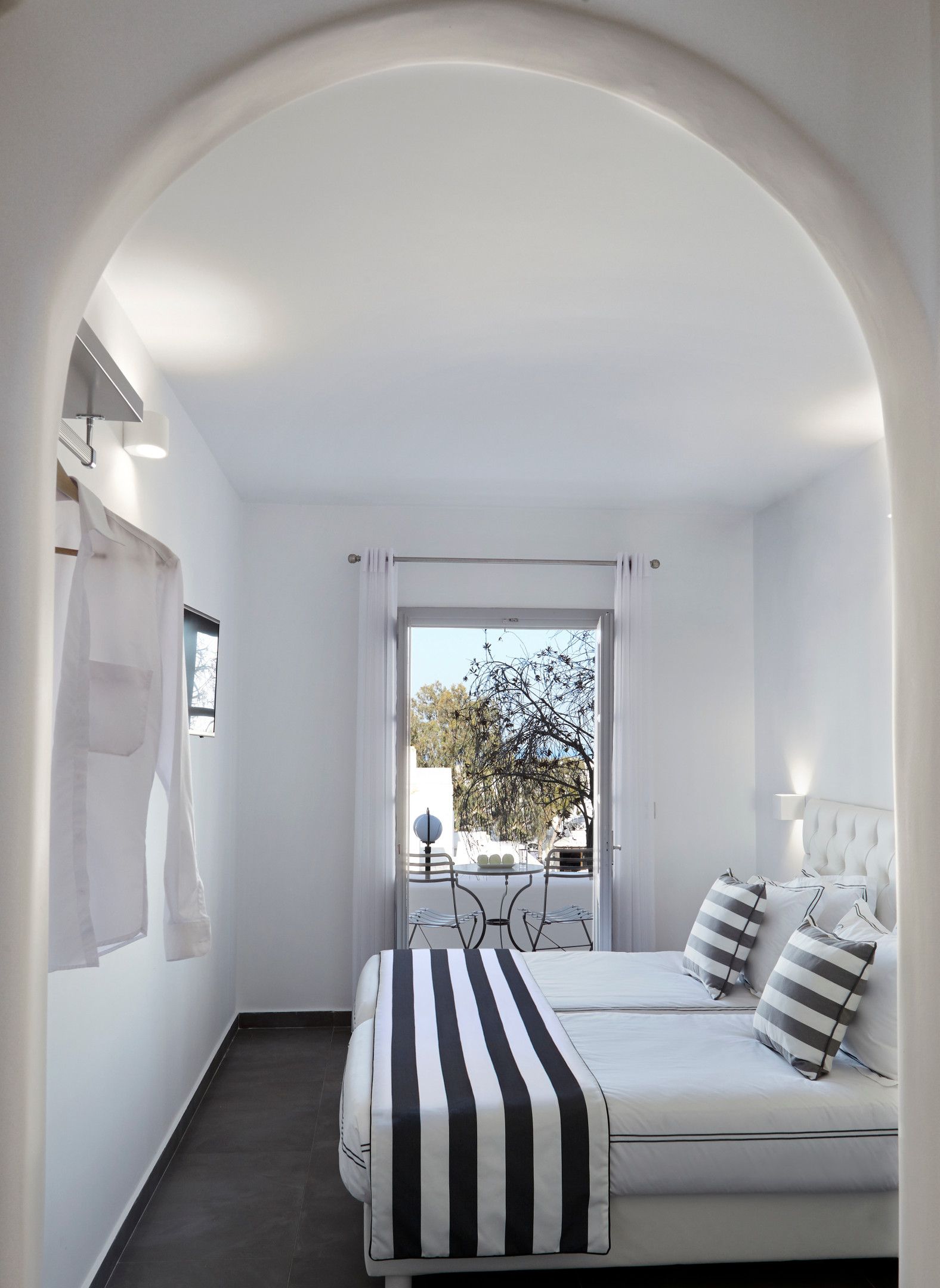 Elegant White Deluxe Room with Private Balcony