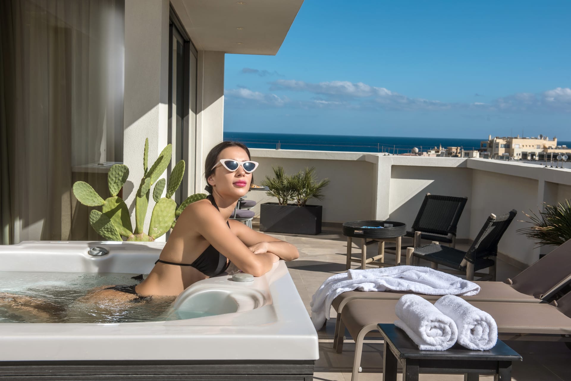 Junior Suite with Outdoor Jetted Tub and Side Sea View