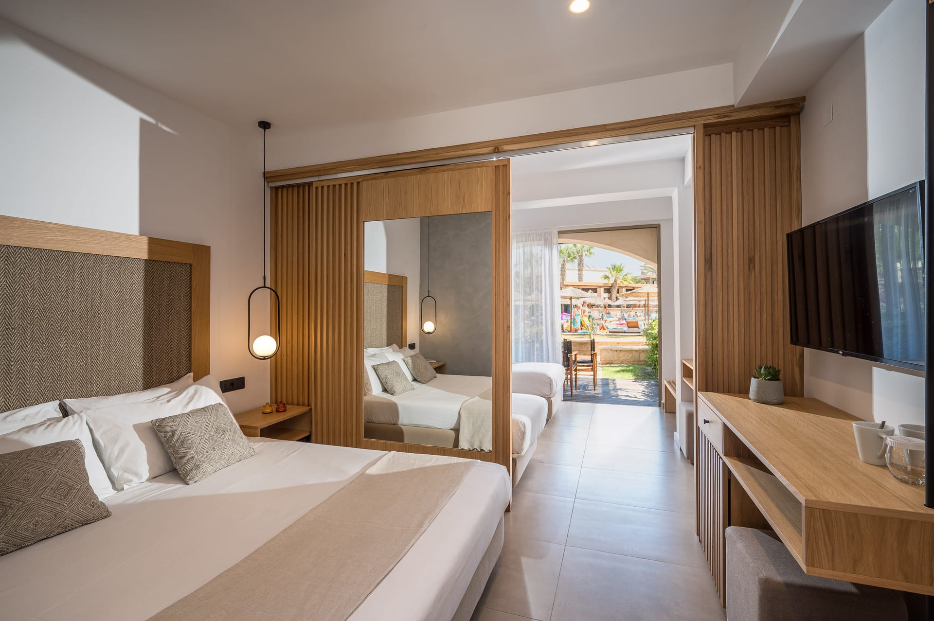 Family room with two bedrooms and pool view/garden view