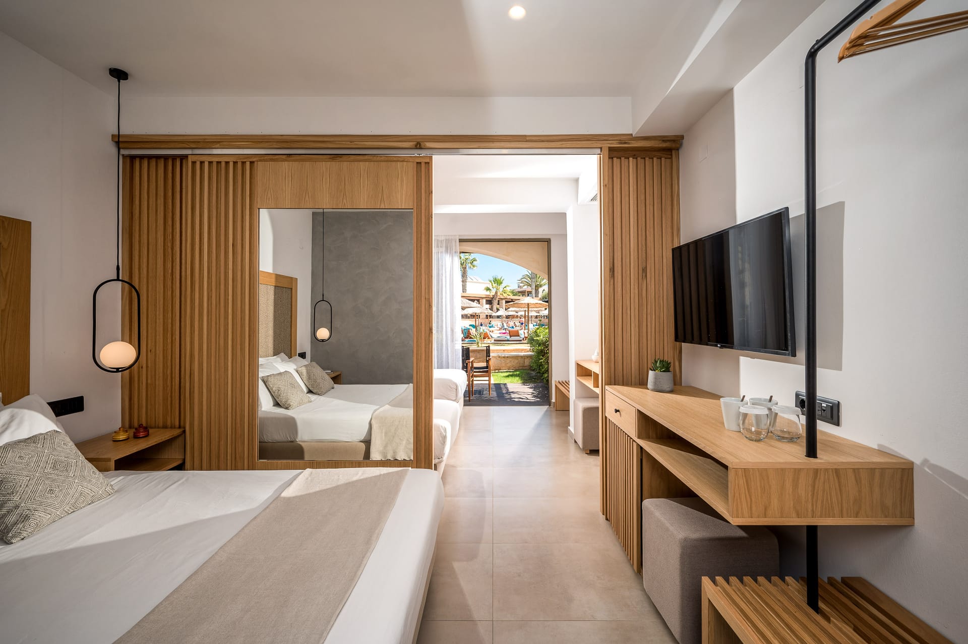 Family room with two bedrooms and pool view/garden view